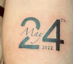 a close up of a person's leg with a tattoo on it that says, may 4th