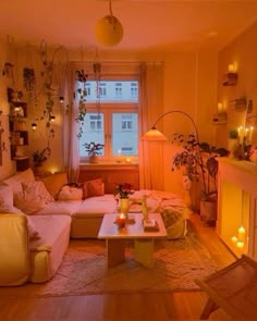 a living room filled with lots of furniture next to a fire place in front of a window