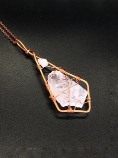 This is a stunning light pink colored pendant. It is made of a tumbled raw stone of rose quartz and rose quartz bead in Scythian tribal style. The stone length is around 2.5 inch, after wrapping it's about 4.5 inches with bail. I've wrapped it in copper wire in unique pattern. It comes with a copper chain 23 inches long.Rose Quartz purifies and opens the heart at all levels to promote love, self-love, friendship, deep inner healing and feelings of peace. Calming and reassuring, it helps to comfo Raw Quartz Stone Pendant Necklace, Spiritual Rose Quartz Gemstone Necklaces, Healing Rose Quartz Gemstone Necklace, Rose Quartz Necklaces With Natural Stones For Healing, Rose Gold Crystal Necklaces With Rose Quartz Gemstone, Bohemian Rose Quartz Healing Jewelry, Rose Gold Rose Quartz Hand-wrapped Jewelry, Hand Wrapped Rose Quartz Jewelry In Rose Gold, Rose Quartz Gemstone Necklaces For Meditation