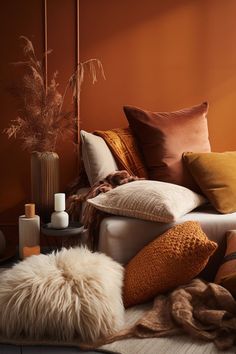 a living room filled with lots of pillows and blankets