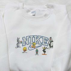 Nike x Looney Tunes Embroidered Shirt, Cartoon Embroidered Shirt, Nike Inspired Embroidered Shirt Welcome to Tinicloset, the ultimate destination for exciting and vibrant custom embroidered apparel. Our clothing store is proud to offer a wide range of products, including custom embroidered shirts, sweatshirts, t-shirts, and hoodies that are sure to capture your imagination. With our unique collection featuring the thrilling Nike x Looney Tunes embroidered shirt, captivating cartoon embroidered s Embroidered Nike Crewnecks, Nike Embroidered Sweatshirt, Nike Cartoon, Disney Character Shirts, Nike Inspired, Nike Sweatshirt, Nike Sweatshirts, Embroidered Clothes, Inspirational Celebrities