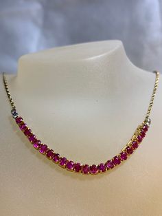 This necklace  will elevate your whole outfit for any special occasions.  Natural Burmese Ruby and Natural Diamonds Necklace in 18K Solid Yellow  Gold.  Weight of Ruby  22pcs  3.37 ct Weight of  Natural Diamonds. 4 pcs .012 ct Total weight of necklace  6.55 gm Length and width of each ruby  3.15 x 2.91 mm , 2.74 x 2.68 mm, 3.19 x2.79 mm (average) Length of necklace - 42 cm Length and width of ruby and Diamond  71.33 x 3.22 mm Gemstone  -  Unheated Natural Burmese Ruby Treatments -  None Colour Elegant Stone Necklace For Anniversary, Elegant Gemstone Tennis Necklace For Anniversary, Classic Formal Necklace With Stones, Classic Formal Necklaces With Stones, Anniversary Round Gemstone Tennis Necklace, Elegant Diamond Studded Necklace For Formal Occasions, Anniversary Gemstone Tennis Necklace, Formal Necklaces With Stones, Yellow Gold Necklaces With Stones For Anniversary