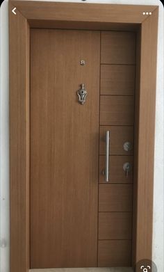 the door is made of wood and has metal handles