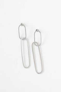 Keep it all together with the timeless style of the paperclip chain link. Handcrafted with careful attention to detail, the Ellipse Collection boasts an eye-catching linked design that is both a statement and lightweight. Classic yet modern, this collection is ageless. Handmade earrings featuring two interlocking metal hoops that create an elegant yet statement-making design. - Sterling silver and vermeil in high polish finish- Oxidized silver in satin finish- About 3" long Modern Silver Paperclip Jewelry, Modern White Gold Jewelry With Paperclip Chain, Modern Tarnish Resistant Oblong Jewelry, Modern Link-style Earrings With Box Chain, Modern Metal Earrings With Hooks And Links, Modern Metal Earrings With Hook Style, Modern Jewelry With Box Chain Drop Earrings, Modern Silver Paperclip Chain Jewelry, Modern Oblong Chain Jewelry