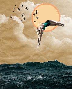 a woman diving into the ocean with birds flying over her