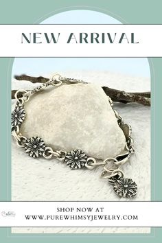 Celebrate nature with the Daisy Chain Silver Bracelet, handmade from Argentium sterling silver and fine silver. This nature-inspired bracelet features dainty daisies, bringing the charm of flowers to your wrist. It has a half-inch of adjustability for a comfortable fit. The simple, elegant design looks great solo or stacked with other bracelets.

Daisies symbolize new beginnings, hope, and joy. They teach us the beauty of resilience and the importance of  finding happiness in small things. Handmade Sterling Silver Spiritual Chain Bracelet, Bohemian Sterling Silver Bracelet With Lobster Clasp, Bohemian Sterling Silver Jubilee Chain Bracelet, Nature-inspired Sterling Silver Bracelet, Nature-inspired Sterling Silver Bracelet Jewelry, Silver Nature-inspired Bracelet Jewelry, Mountain Earrings, Signature Necklace, Jewelry Bracelets Silver