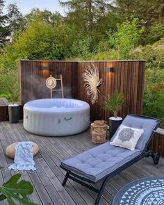 a hot tub sitting on top of a wooden deck