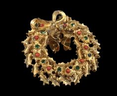 "Stunning faux coral ballotini ball, emerald green rhinestone and gold tone dangling bells wreath brooch.  Unsigned.  Circa 1950's 1960's.  Classic, attractive and very merry Christmas jewelry piece.   In very good condition.  2\" in diameter.  We welcome your inquiries." Vintage Gold Jewelry For Christmas, Vintage Jewelry For Holiday Parties, Vintage Holiday Jewelry For Party, Vintage Christmas Jewelry For Celebration, Vintage Holiday Party Jewelry, Vintage Christmas Celebration Jewelry, Holiday Party Vintage Jewelry, Vintage Gold Jewelry For Holidays, Gold Holiday Brooch Jewelry