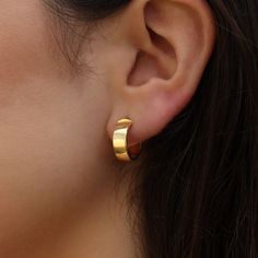 PRODUCT DESCRIPTION * These stylish 9ct Gold Chunky Huggie Hoops are crafted with thick solid 9ct gold, making them perfect for everyday wear. These mini creole hoops add a touch of gold shimmer to your style. *These stylish huggie earrings are the ideal accessory, whether it's a treat for yourself or a thoughtful gift, these chunky huggie hoops are a timeless choice. * These classic 9ct Gold Chunky Huggie Hoops are an essential addition to any jewellery collection. ONE YEAR WARRANTY- We offer a Gold Huggie Earrings, Solid Gold Earrings, Gift For Music Lover, Touch Of Gold, Huggie Earrings, Gold Shimmer, Huggie Hoop Earrings, Personalized Birthday Gifts, Bridal Hair Accessories