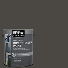 a red paint can with the words behr premium plus ultra on it's side