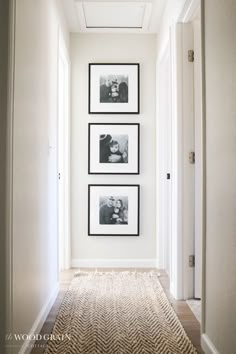 the hallway is clean and ready to be used as a place for family photos on the wall