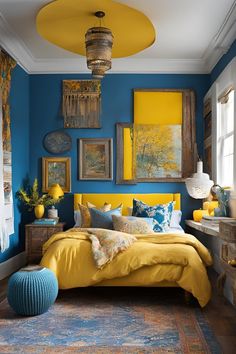 a bedroom with blue walls and yellow bedding in the center, along with pictures on the wall