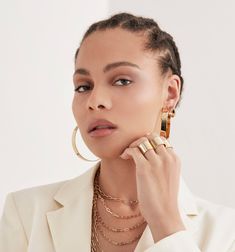 Mini Peak Hoops are minimal and dainty but make a statement. These are a strong piece to add to your everyday look. You can wear these alone for a minimalist look or stack these with other hoops to make more of a statement. Material: Brass with stainless steel posts. Plating available: 10k Gold or Rhodium Our jewelry has a clear protective coating to prevent from quick wear and tarnishing. Hoop earring measurements: Outside Diameter - .75" Width: 3/8" Our jewelry is always handcrafted from susta Hoops Gold, Skirt Belt, Body Size, 10k Gold, Everyday Look, Plus Size Dresses, Personal Style, Hoop Earrings, Plating