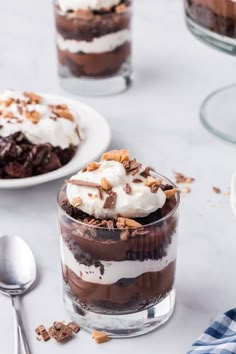 two desserts with chocolate pudding and whipped cream