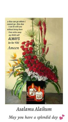 a vase filled with red flowers and two lit candles next to a card that says, aslamu alukum may you have a splendid day