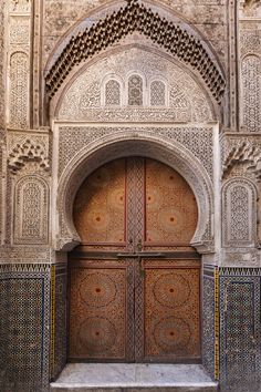 an ornate door in the middle of a building