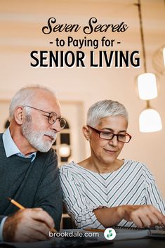 an older couple sitting at a table working on a laptop with the text seven secrets to paying for senior living