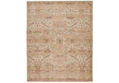 a beige rug with an intricate design on it