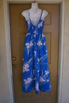 Vintage 1960s maxi dress. One side pocket! LABEL: Paradise Hawaii MODERN SIZE ESTIMATE: -Labeled as a small MEASUREMENTS: taken while garment is lying flat - stretchy elastic back bust: 17 inches across back waist: 12 inches hips: 23 inches length: 53 inches CONDITION: good vintage - one minor issue shown in last photo Sleeveless Hawaiian Maxi Dress With Tropical Print, Hawaiian Maxi Dress With Tropical Print For Beach Season, Tropical Print Maxi Sundress, Vintage Printed Maxi Dress For Vacation, Tropical Hibiscus Print Maxi Dress For Spring, Sleeveless Hibiscus Print Maxi Dress For Vacation, Hawaiian Floral Print Maxi Dress, Hawaiian Maxi Dress With Floral Print, Hawaiian Maxi Dress With Hibiscus Print For Vacation