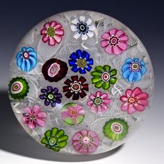 a glass plate with flowers painted on it