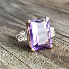 Details: Beautiful vintage mid-century amethyst ring set in 14K yellow gold filigree with diamond side details. The dramatic deep purple amethyst is large, measuring 15.9 x 11.8mm, and is surrounded by 24--1.6mm diamonds. This is a fabulous ring--you will not be disappointed! Please ask all necessary questions prior to placing an order. Measurements: The size is 6 US and can be sized for a fee. The amethyst measures 15.9 x 11.8mm. Ring weighs 6.7 grams. Condition: The overall all condition of th Purple Amethyst Art Deco Ring For Anniversary, Art Deco Purple Amethyst Ring For Anniversary, Classic Purple Diamond Ring With Accent Stones, Amethyst Ring With Diamond And Gemstone Accents, Purple Amethyst Ring With Diamond And Gemstone Accents, Heirloom Purple Amethyst Ring With Center Stone, Classic Amethyst Ring With Brilliant Cut, Classic Purple Diamond Ring With Prong Setting, Purple Diamond Ring In 14k Gold For Anniversary