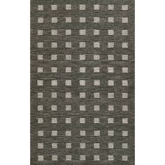 a gray rug with white squares on it