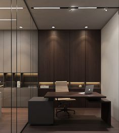 an office with a desk, chair and laptop on the table in front of glass partitions