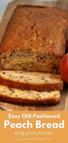 a loaf of bread sitting on top of a wooden cutting board next to two apples