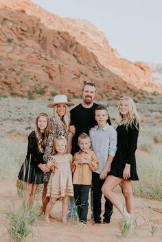 a family posing for a photo in the desert