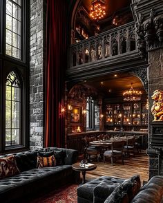 an ornately decorated room with couches, tables and chandeliers