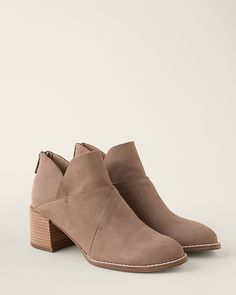 A modern, minimalistic short boot to complement any outfit. Crafted in tumbled nubuck leather with an almond toe, bold stitching, and a curved vamp for lots of character, plus toe-to-heel padding for lots of comfort.  By EILEEN FISHER. Back zipper. Extended welt with stitch detailing. Leather-wrapped footbed with padded toe, arch, and heel. Stacked leather heel. Leather and man-made sole; man-made heel cap. Fall Ankle Boots With Wrapped Heel, Fall Boots With Wrapped Heel And Almond Toe, Casual Boots With Wrapped Heel For Fall, Casual Fall Boots With Wrapped Heel, Casual Wrapped Heel Boots For Fall, Fall Suede Boots With Wrapped Heel, Casual Leather Boots With Wrapped Heel, Casual Ankle Boots With Wrapped Heel, Suede Ankle-high Boots With Wrapped Heel