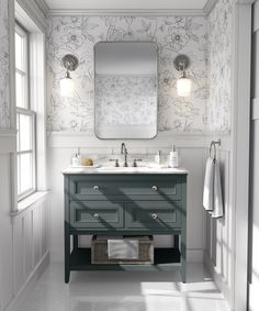 a bathroom vanity with two sinks and a large mirror above it, in front of a window