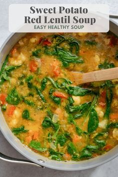 a pot filled with red lentil soup on top of a table