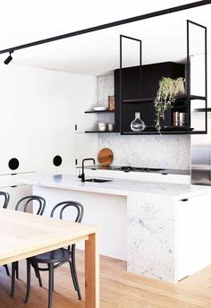 the kitchen is clean and ready to be used as a dining room or office space