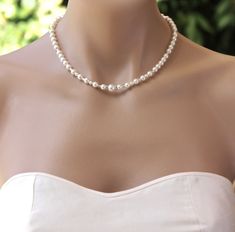 "Bridal Pearl necklace has been designed with Swarovski pearls, crystals and bead accents to create an elegant and simple necklace. This necklace is a twist on the classic pearl version, with subtle sparkle allowing the pearls to take center stage. This is also available in 18 K gold and Rose Gold. Please leave a note at checkout if you would like either of these. If no note is left, the silver version will be supplied. Measures: L = 15\", 17\", 19\" (38 cm,43 cm, 48cm) 💛💛 Please note: 15\" - Bridal Backdrop, Pearl Necklace Bridal, Bridal Backdrop Necklace, Backdrop Necklace, Classic Pearl Necklace, Backdrops Necklace, Romantic Necklace, Bridal Pearl Necklace, Back Necklace