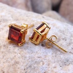 "This Sterling Silver Earring features an Elegant Art With Natural Garnet Gemstone. The cavity is made from genuine 18k Gold Filled over solid 925 sterling silver and stamped as S925. This Jewelry is Lead free. ITEM DESCRIPTION Item Code: JACBS9/37 E Metal: 18k Gold / Rose Gold plated over 925/92.5 Sterling Silver Gemstone: Genuine Natural Garnet Gemstone Shape: Square Faceted Gemstone Size: 6 MM Earring Length: 6 MM Earring width: 6 MM Surrounded Stones: None Weight: 1.84 gm Finish: Gold/ Rose Gold Plated Earrings With Prong Setting As Gift, Smokey Topaz Ring, Smoky Quartz Ring, Blue Topaz Earrings, Tiny Earrings, Small Earrings Studs, Art Deco Earrings, Emerald Earrings, Delicate Earrings