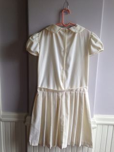 "Circa late 1960's early 1970's vintage dress for a young girl. Beautiful little dress, dropped waist Chemise style Marked a size 12. Measurements are; Armpit to armpit13\" Shoulder to shoulder14\" Waist13\" Length25\" Sleeves3\" Feel free to convo me with any further questions. Thank you for your interest." Spring School Dress With Peter Pan Collar, Pleated School Dress For Spring, Pleated School Dress For Summer, Spring School Pleated Dress, Spring Pleated School Dress, Pleated Summer School Dress, Summer School Pleated Dresses, Classic Short Sleeve Dress For Dress-up, Fitted Short Sleeve Dress For School