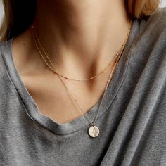 "The perfect set to start your everyday stack. Includes two simple layering necklaces--a dainty satellite chain and a personalized pendant--with your choice of customization (a symbol or initial)!  Every piece is handcrafted and hand-personalized with love in La Conner, WA, using 90% recycled and 100% ethically sourced raw materials from the USA--because it's better that way. Includes free gift-ready packaging (featuring a care card and traditional letterpress goodies made by my dad)!  MATERIALS: * Gold = 14k gold filled * Silver = sterling silver * Rose gold = 14k rose gold filled DETAILS: * Includes 13mm medium disk necklace * Hand-personalized with traditional metal punches * Includes satellite chain with tiny beads AT CHECKOUT: * If you chose \"other\" for length, specify which length Necklace Stacking, Necklaces Dainty, Personalized Pendant Necklace, Layered Necklace Set, Gold Bead Necklace, Sterling Necklaces, Infinity Necklace, Personalized Pendant, Blog Instagram