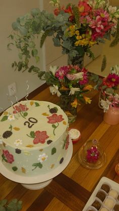 a cake sitting on top of a wooden table