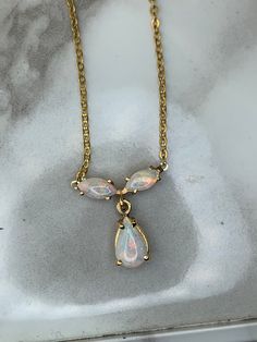 14kt yellow gold necklace set with genuine opals! Weighs 1.7dwt, is .63" long and .50" wide and comes on a 14kt 19" chain! Formal Opal Necklace With 17 Jewels, Elegant Gold Jewelry With Pink Opal, Elegant Opal Necklaces With Adjustable Chain, Elegant Ethiopian Opal Necklace In Yellow Gold, Gold Pink Opal Necklace For Gift, Gold Pink Opal Necklace For Gifting, Yellow Gold Opal Pendant Necklace, Yellow Gold Teardrop Opal Necklace, Yellow Gold Pink Opal Jewelry For Gift