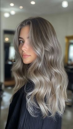 Silver balayage offers a soft, seamless blend of silver hues for a natural, sun-kissed effect. This look adds a touch of elegance and dimension to your hair. Click the pin and follow us for more stunning hair color ideas! #SilverBalayage #HairInspo #ElegantStyle #BalayageGoals #ChicHair Dark Blonde Hair With Ash Highlights, Silver Hair On Tan Skin, Beige Balayage Short Hair, Grey Light Brown Hair, Dark Icy Blonde Hair, Ash Brown Hair With Platinum Highlights, Muted Summer Hair Color, Icey Balayage Hair, Ash Blonde Balayage Dark Roots