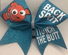 "Cheer Bow Back Spot I touch the BUTT GORGEOUS turquoise glitter (or any color on chart) by blingitoncheerbowz This listing is for a new, handmade (by me) cheer bow. It is on a thick black hair tie and is a BIG bow made on 3\" grosgrain ribbon. Measures about 7 1/2 inches across. Gorgeous My bows are professionally made with a heat press in my bow studio, NOT a hand iron, and I guarantee all bows for the current season. Even if a hair tie breaks, send it back to me and I will fix or replace it. Cheer Bow Designs, Cheer Good Luck Pins, Cheer Gifts Diy, Competition Cheer Bows, Cheer Locker Decorations, Disney Cheer Bows, Cheer Base, Cheer Accessories, Thick Black Hair