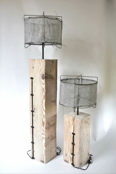 two lamps made out of wood and wire