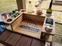 a picnic table with food and drinks on it