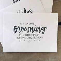 some white envelopes with black ink on them