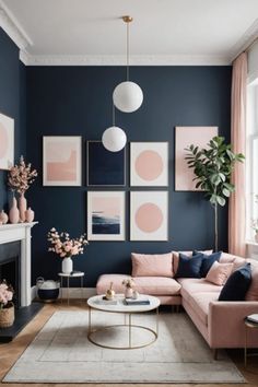 a living room with blue walls, pink couches and pictures on the wall above