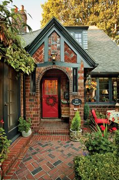 a brick house with a red front door