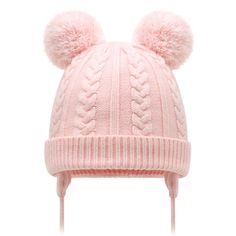 a pink hat with two pom poms on it