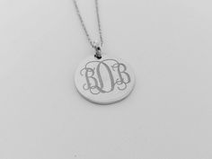 "Silver Monogram Circle Disc Necklace,Monogram Initials necklace,Silver Disk Necklace,Custom Disc Jewelry,Monogram Tag Necklace,Gold Initials Necklace This stunning silver monogram disc necklace is the unique fashion accessory you've been searching for. The design is simple, elegant and absolutely beautiful. This necklace makes a great everyday jewelry piece because it matches so well with any outfit. Wear it to dress up your favorite jeans outfit or wear it out to dinner on date night. This nec Sterling Silver Monogram Round Disc Jewelry, Sterling Silver Laser Engraved Pendant, Laser Engraved Sterling Silver Jewelry, Laser Engraved Sterling Silver Pendant, Silver Medallion Necklace With Monogram, Silver Monogram Medallion Necklace, Silver Jewelry With Initials, Laser Engraved Sterling Silver Necklace, Sterling Silver Initials Medallion Jewelry