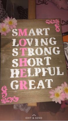 a sign that says smart loving is strong short helpful great with daisies on it